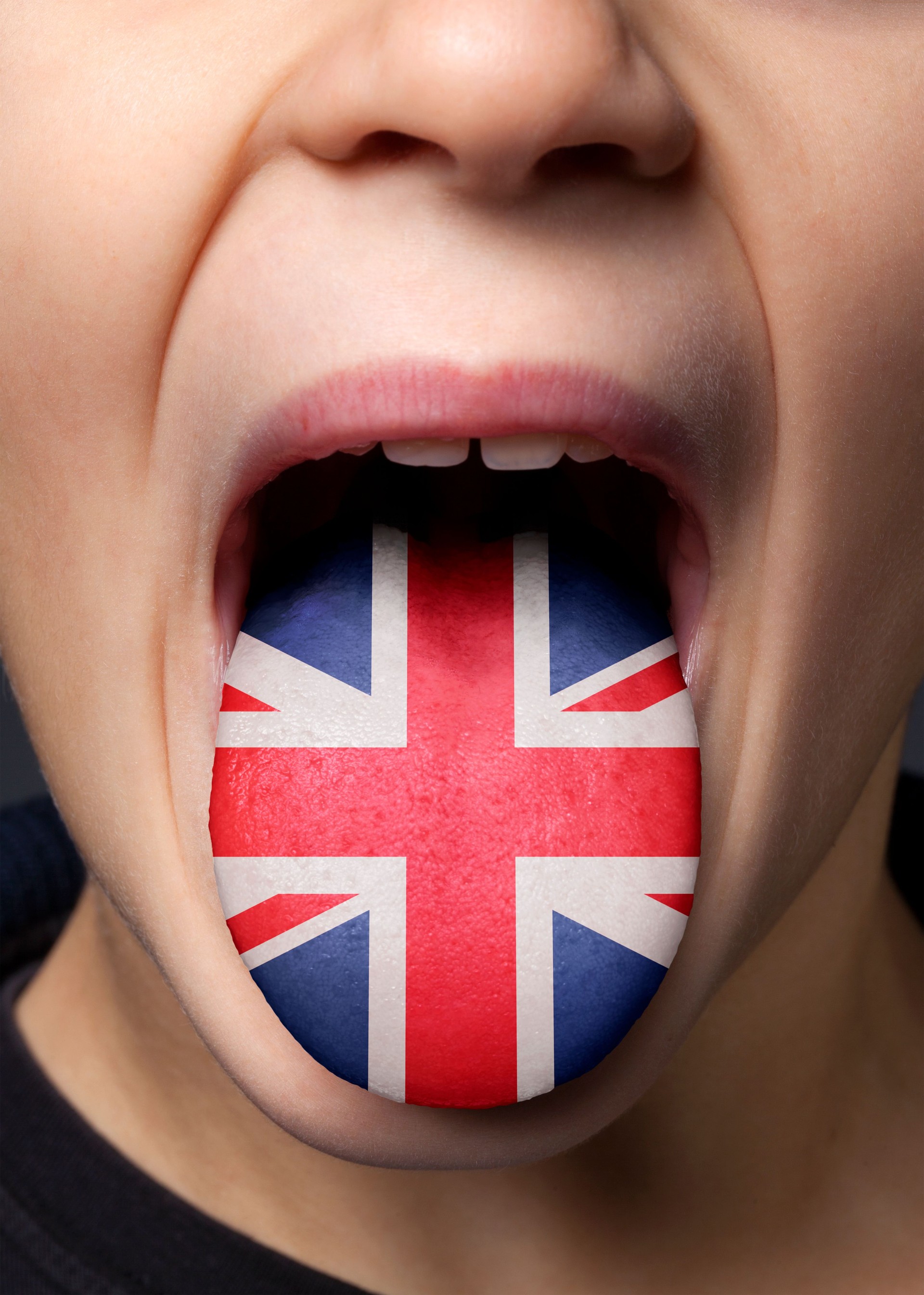 English language. Great Britain UK flag painted in tongue of a child.